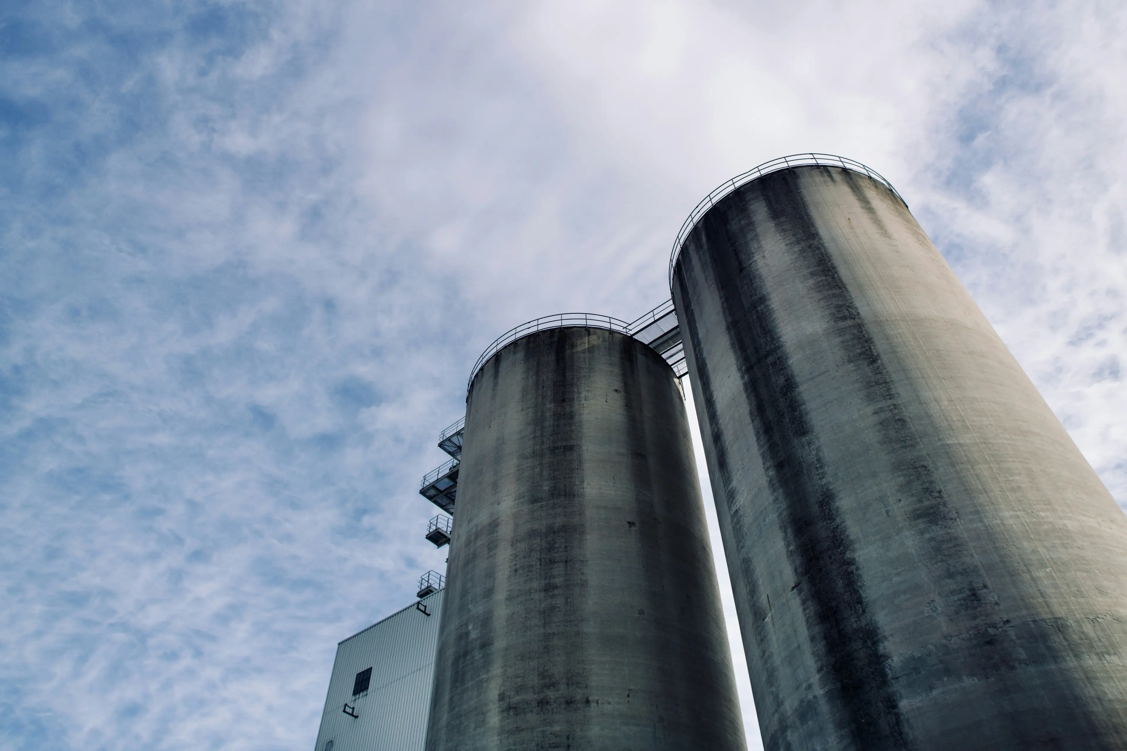 Tall concrete silos against the sky