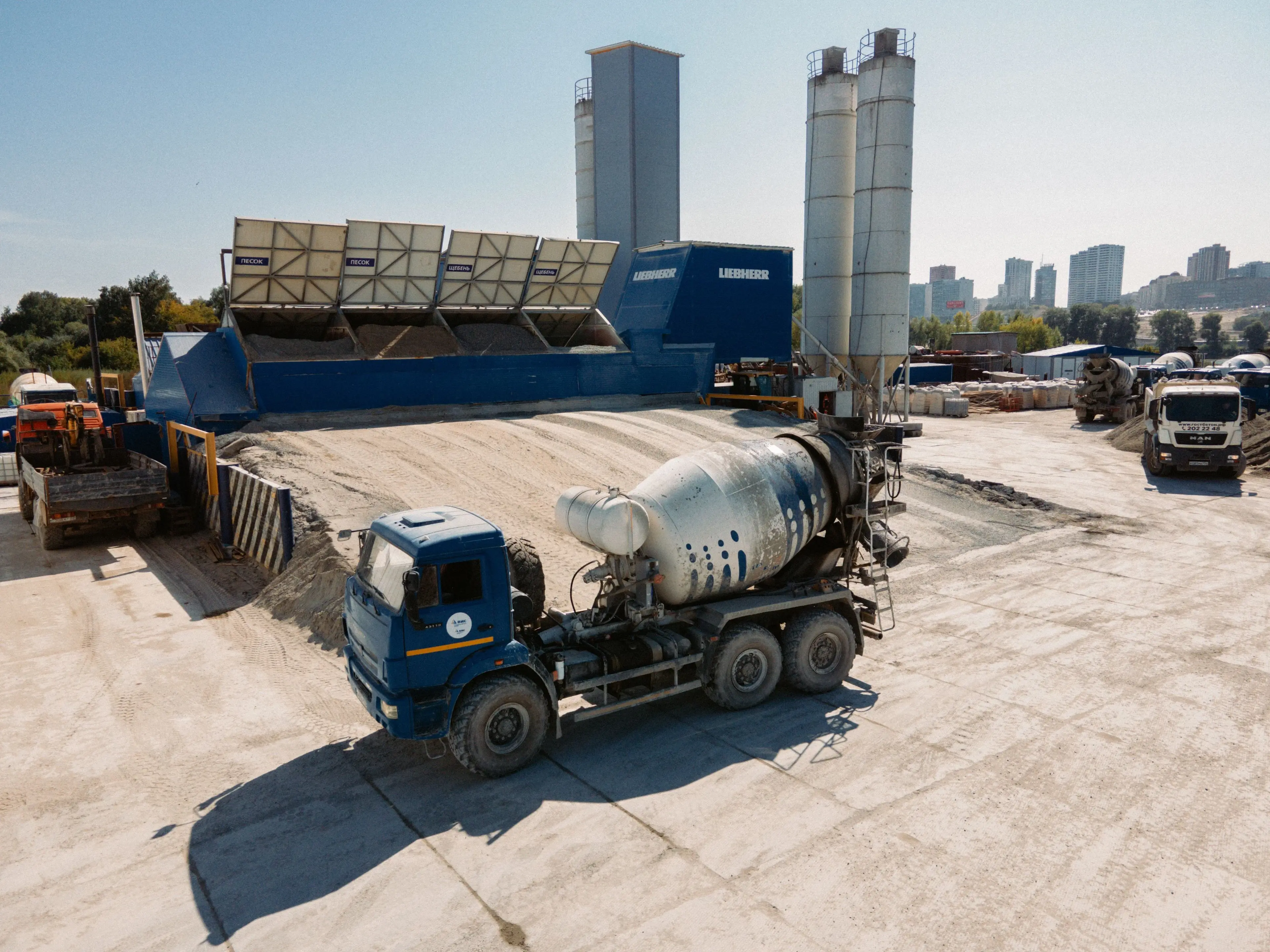 Stainless steel silos with walkways at an industrial plant